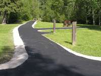 The existing asphalt on all trails was removed, graveled and re-graded. A trail paver was used.