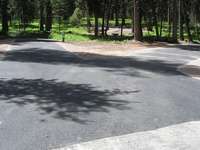 This shows  the two host sites at Seeley Lake Campground which were both grade engineered, graveled, paved and shouldered up. Notice the joint tie-in to our overlay on the main line of the road.